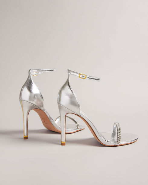 HELENNI-Sandals-Whether you're strutting down the city streets, sipping cocktails at a rooftop bar or dancing the night away, the HELENNI heels are your new partner in crime. With their open toe design, golden detailing to the heel and crystal embellishment, these heels are sure to make a statement. Heeled sandals Crystal embellished band Open toe Padded insole Buckle fastening Gold heel band with logo engraved ring Heel height: 10.3cm- Ted Baker Romania